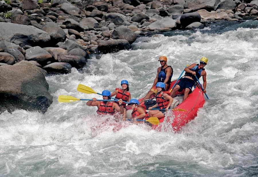 A rafting crew running rapids on a Northern California river.