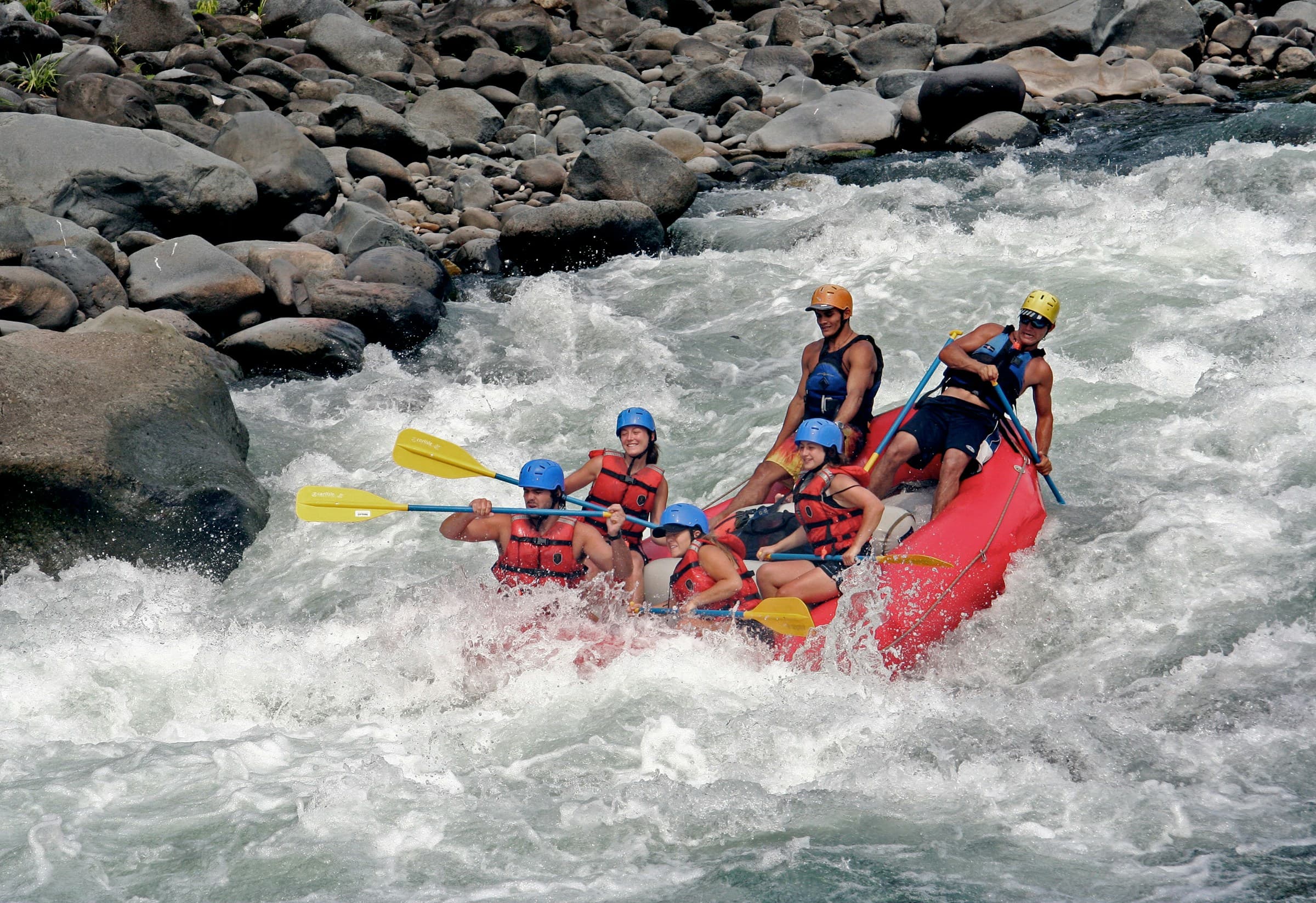 A rafting crew running rapids on the Trinity River.